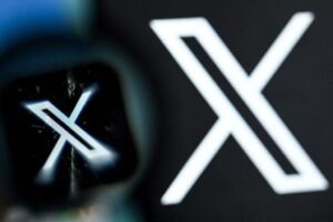 fficial logo of X Chat alongside a smartphone displaying its encrypted messaging interface.